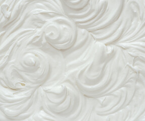 Creamy pics in yoghurt or cream surface. Top view.