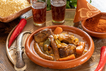 royal couscous with semolina spices and tea on a tray