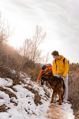 Walking with the dog together on a sunny day while having fun