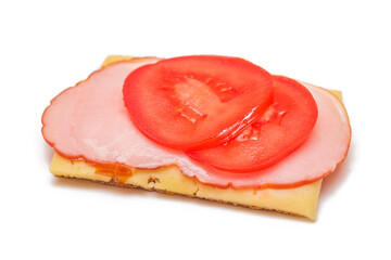 Whole Grain Crispbread with Tomato, Ham and Cheese - Isolated on White. Easy Breakfast. Quick and...