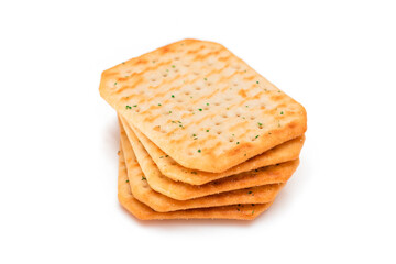 Stack of Crispy Salted Crackers with Greens - Isolated on White. Easy Snack - Isolation