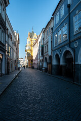 Fototapeta na wymiar Narrow Alley In The Inner City Of Budweis (Ceske Budejovice) In The Czech Republic