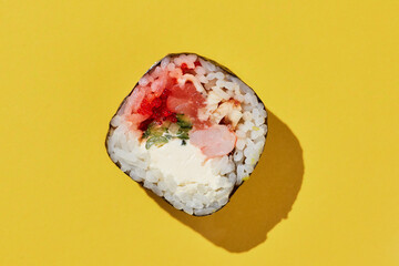 Fresh maki sushi roll on yellow background. - 498049062