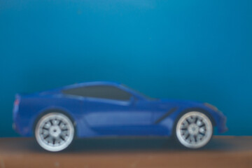 Fototapeta na wymiar Toy car in vivid blue color