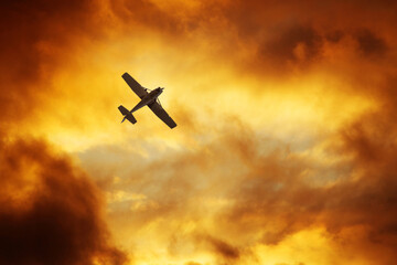 Airplane in the dramatic sky