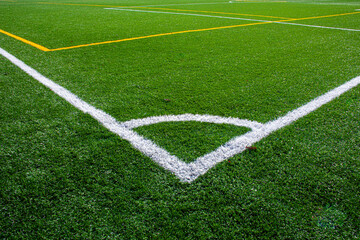 Fototapeta na wymiar Football field with synthetic grass