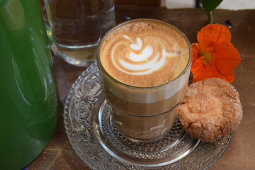 Cappuccino served with a cookie 