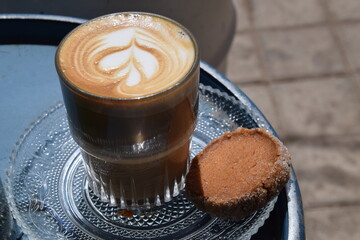 Cappuccino served with a cookie 