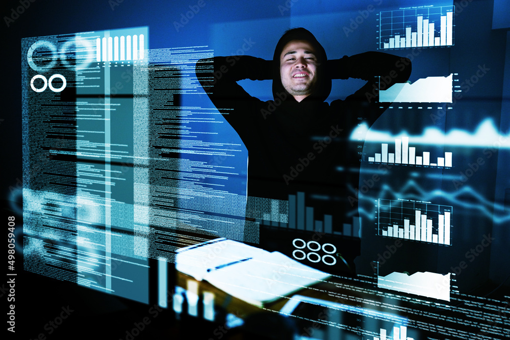 Poster admiring a job well done. portrait of a satisfied computer programmer looking at his work late at ni