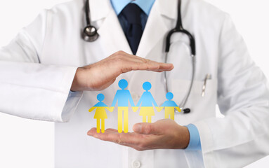 Ukraine medical aid concept, close-up of doctor hands showing symbol icon of family colored in...
