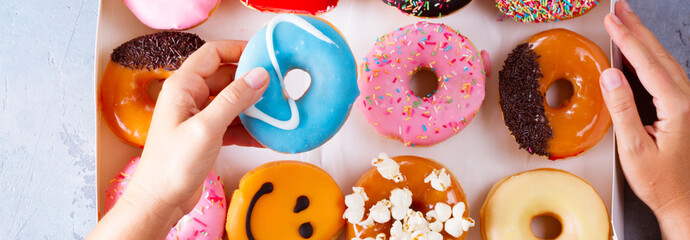 sweet doughnuts on gray stone background