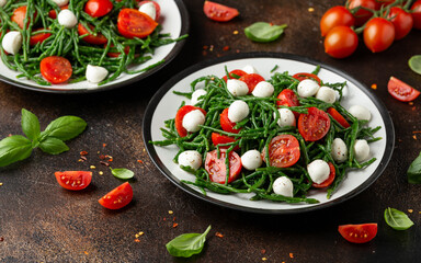 Fresh Samphire salad with cherry tomatoes and mozzarella. Healthy food.