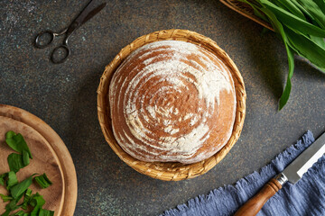 Sourdough bread in a basket with bear's garlic