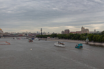MOSCOW, RUSSIA - June 05, 2021: The ships sail along the Moscow river on a cloudy day.