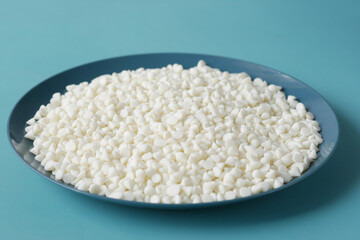 Chocolate chips spilling from a plastic packet,