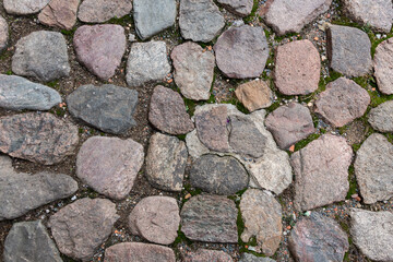 Cobblestone road. Fragment of the pavement. Background.Texture.