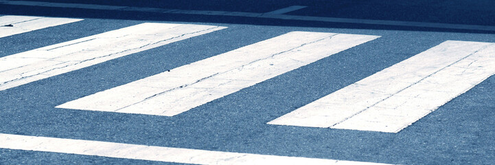 Fototapeta premium White crosswalk for people crossing.