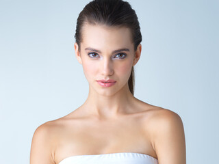 Fresh faced and pure. Studio portrait of a beautiful young woman posing against a blue background.