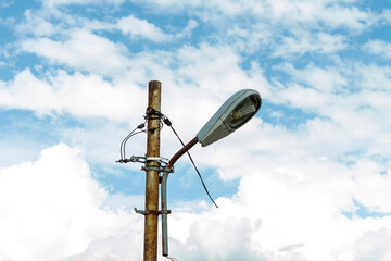 Electric Post and Street Lights on blue sky and cloud background