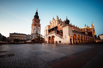 Naklejka na ściany i meble St. Mary's basilica in main square of Krakow. Wawel castle. Historic center city with ancient architecture.