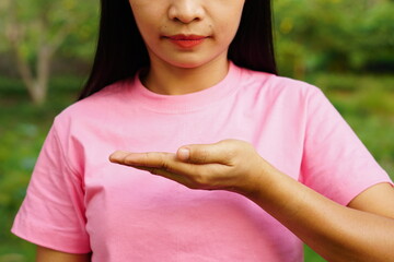 woman looking at her hands in front