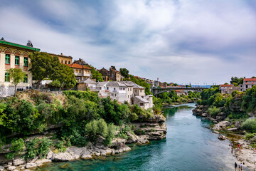 Stunning view of a Mostar river and surrounding town