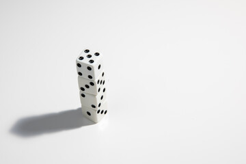White dice stacked up on a white background. Win or lose. Catch your luck. Gambling equipment.
