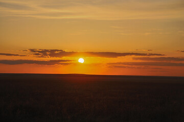 Obraz premium Sunset in the Burtinskaya steppe (Orenburg nature reserve). Orenburg region, Southern Urals, Russia.
