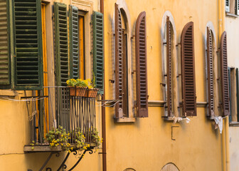 balcony and windows in old classic Italian building 
