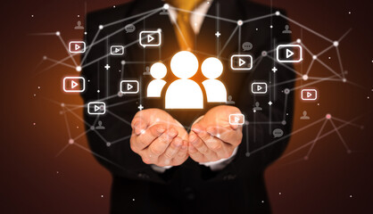 Hand holding social media icons