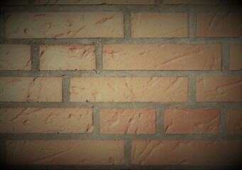a reddish brown brick wall as background