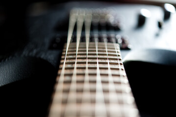 close up of a guitar, blurred focus	
