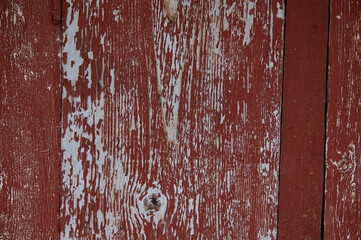 Obraz premium grunge background: stripped old boards painted with red paint