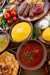 Homemade Romanian Food with 
pies, polenta, borscht, vegetables, fish, meat, stew, cheese and wine. Traditional dishes from Romania and the Republic of Moldova.
