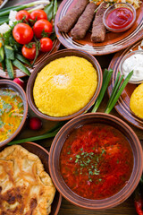 Homemade Romanian Food with 
pies, polenta, borscht, vegetables, fish, meat, stew, cheese and wine. Traditional dishes from Romania and the Republic of Moldova.