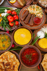 Homemade Romanian Food with 
pies, polenta, borscht, vegetables, fish, meat, stew, cheese and wine. Traditional dishes from Romania and the Republic of Moldova.