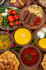 Homemade Romanian Food with 
pies, polenta, borscht, vegetables, fish, meat, stew, cheese and wine. Traditional dishes from Romania and the Republic of Moldova.