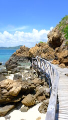 Walking way of wooden bridge along the shore at koh kham island sattahip, chonburi, thailand.