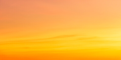 orange sunset sky in the evening on gold hour sky background 