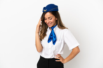Airplane stewardess over isolated white background laughing