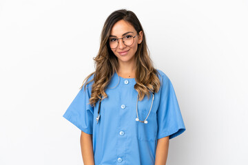 Young surgeon doctor woman over isolated white wall laughing