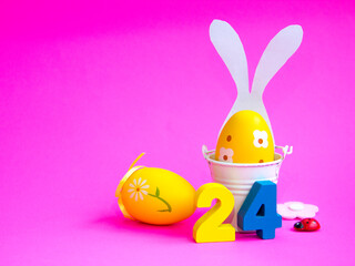 Easter minimalistic interior decor. with white bunny ears on a pink background. bright Easter holiday on April 24, free space