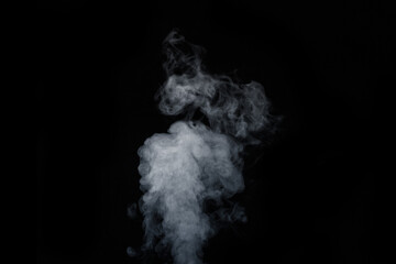 Curly white steam rising up and splashing water scattering in different directions isolated on a black background. Can be used as background, design element