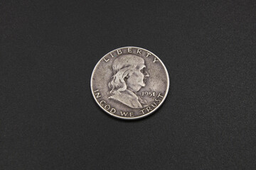 Vintage half dollar coin on black background