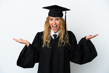 Young university graduate isolated on white background with shocked facial expression