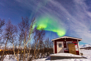 Abisko, Aurora Borealis in Lapland. Sweden lights in the sky full of stars. Land of the Sami people. 
Solar wind colors