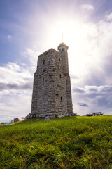 Tall stone tower being lit up with beautiful afternoon sunlight. Sky Top Tower, Mohonk Preserve New...