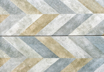 Ceramic tiles with a geometric pattern and aging effect.