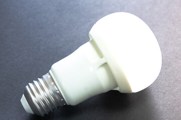 Selective focus of burning white led bulb on an isolated background. The bulb has no electrical...