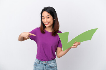 Young Vietnamese woman isolated on white background holding a check icon and pointing it